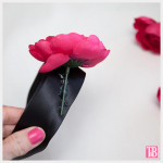 DIY Kentucky Derby Headband gluing flowers by Trinkets in Bloom