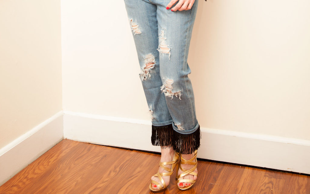 DIY distressed jeans with fringe added to the cuffs